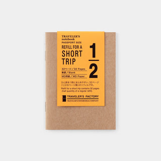 Traveler's Factory passport-size short trip notebook refill on brown kraft paper with orange label