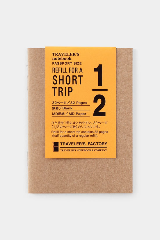 Traveler's Factory passport-size short trip notebook refill on brown kraft paper with orange label