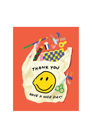 Stationery thank you card with yellow smiley face and “Thank you” message