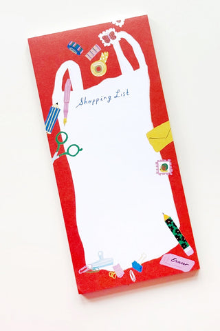 Shopping list notepad with red cover and colorful stationery-themed illustrations