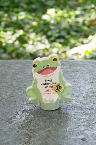 Frog mini die-cut calendar with yellow-green body and circular date badge