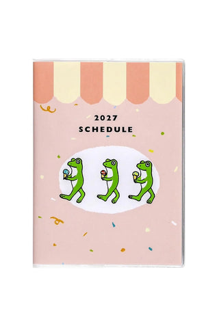 A6 monthly planner cover with 2027 schedule text and three green cartoon frogs