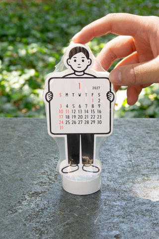 Noritake 2027 boy stand calendar, hand adjusting the freestanding figure