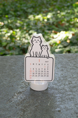 Noritake 2027 stand calendar with two cats illustration and monthly date grid