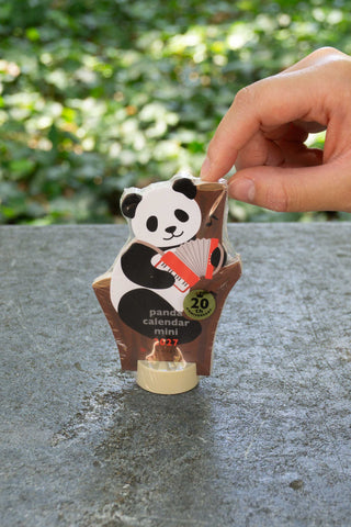 Panda mini die-cut desk calendar held by hand, 2027 badge at front