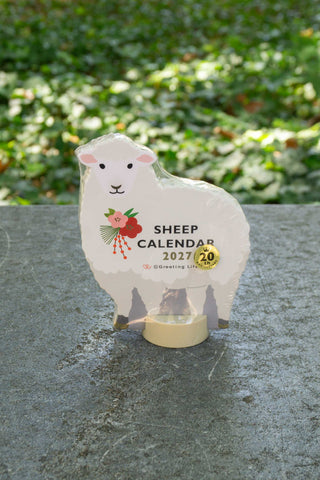 Sheep die-cut desk calendar with 'SHEEP CALENDAR 2027' and small base stand