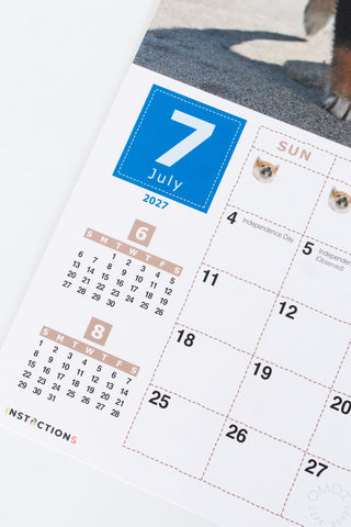Shiba Inu wall calendar close-up of July dates with small dog photo