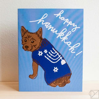 Hanukkah dog sweater greeting card: brown dog in navy sweater, “Happy Hanukkah”