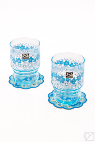 Blue retro stacking glass set with floral print cups and matching coaster plates