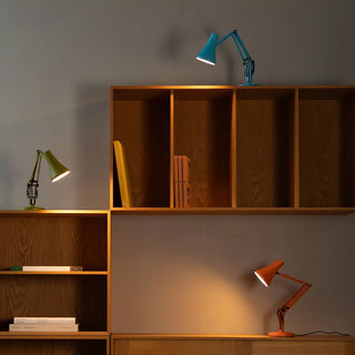 Sunburnt orange mini desk lamp with angled shade and metal base