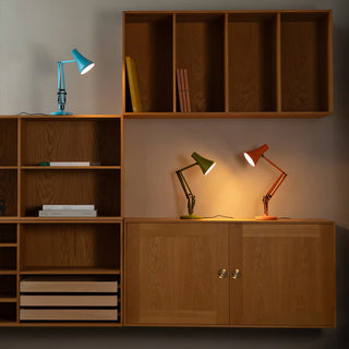 Sunburnt orange mini desk lamp with angled shade and articulated metal stand