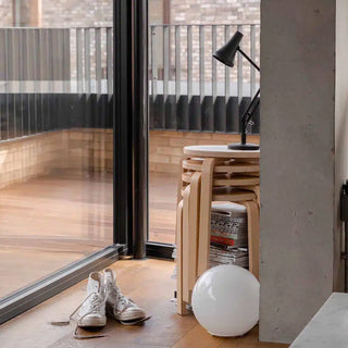 Carbon black mini desk lamp with conical shade and articulated arm on a small base