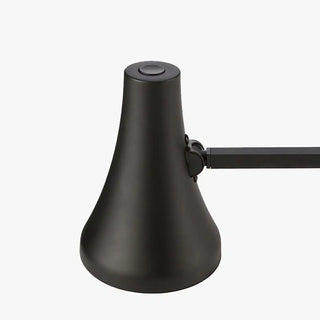 Carbon black mini desk lamp with conical shade and adjustable joint, angled view