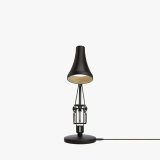 Carbon black mini desk lamp with conical shade, visible mechanisms, and round base