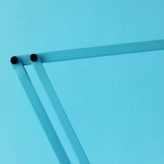 Turquoise articulated desk lamp arm with black pivot knobs