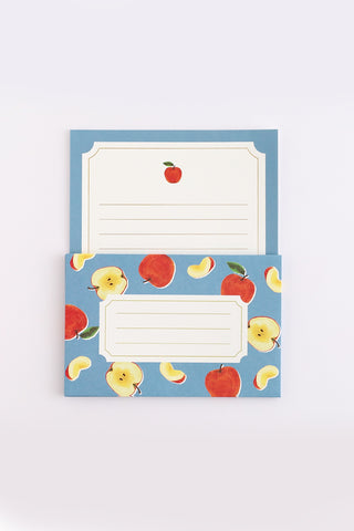 Blue fruit-pattern letter card with apple and banana designs, blank writing panel