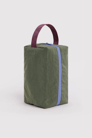 BAGGU dopp kit in olive green with maroon handles and blue zipper trim