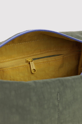 Toiletry kit zipper pull on yellow lining with blue edge trim