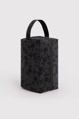 Charcoal floral toiletry bag with top handle and boxy shape