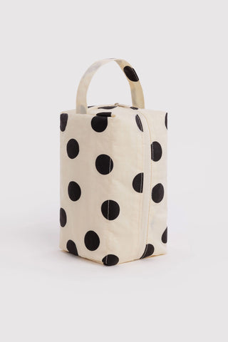 Cream polka dot dopp kit with black dots, fold-up top handle and front zipper