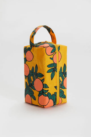 BAGGU Orange Tree dopp kit in orange with fruit-and-leaf print, top handle