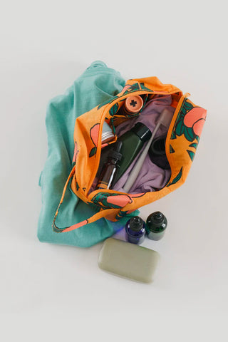 BAGGU Orange Tree dopp kit, open top showing interior pouch and zipper