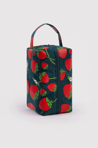 BAGGU dopp kit with strawberry print, zippered top and carry handle, dark teal base.
