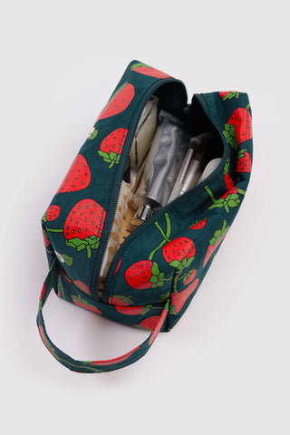 BAGGU dopp kit open with strawberry print lining and zipper, fabric carry strap, teal.