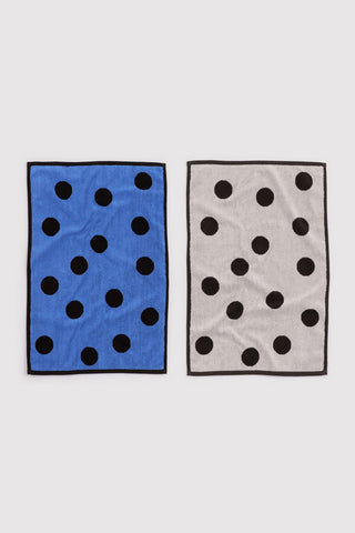 Polka dot hand towel set of 2: blue towel with black dots and light towel with black dots.