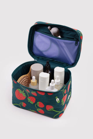 BAGGU large cosmetic case open, dark teal strawberry print with mesh pocket and toiletries.