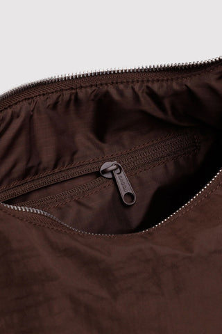 Coffee-brown nylon bag interior with zip pocket