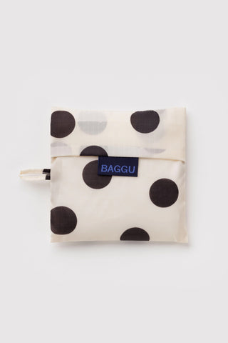 Foldable cream tote pouch with black polka dots and BAGGU label