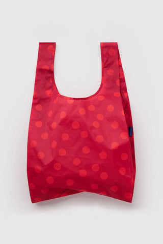 Red polka dot reusable tote bag with open top and U-shaped handles