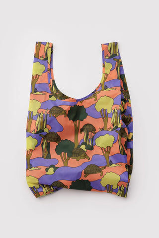 Standard tote bag in orange, purple, and green with turtle-themed pattern