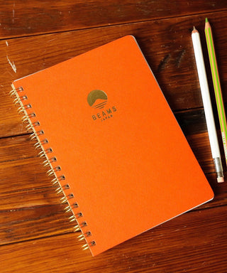 BEAMS Japan B6 lined notebook, orange with spiral binding and logo