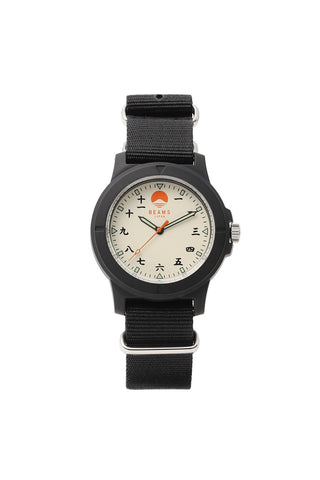 Black wristwatch with cream dial, dark hands, numerals, and black fabric strap