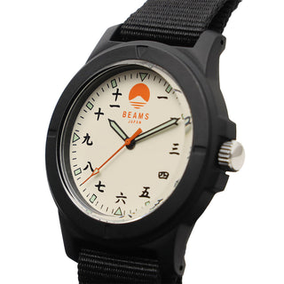 Black wristwatch face close-up with BEAMS logo, orange accents, and numeral markers