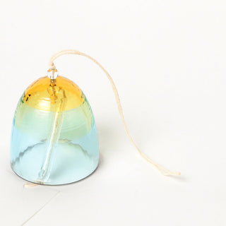 Small gold and blue glass bell wind chime with beige cord and paper tag