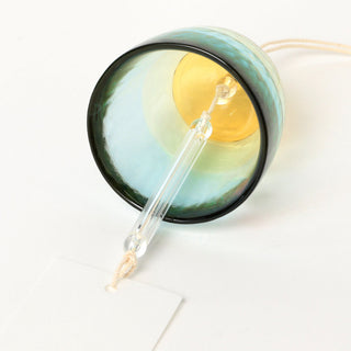 Blue glass bell wind chime with gold interior and clear striker on cord