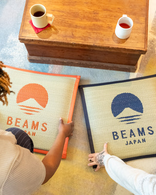 Hagihara x BEAMS Japan cushions, orange and navy square woven covers with BEAMS JAPAN logos