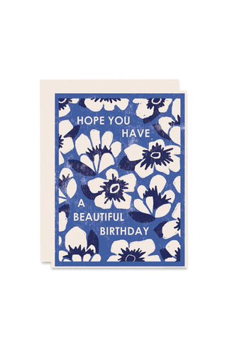 Birthday greeting card with blue floral letterpress design and message