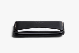 Bellroy black leather card slip in side view with thin profile