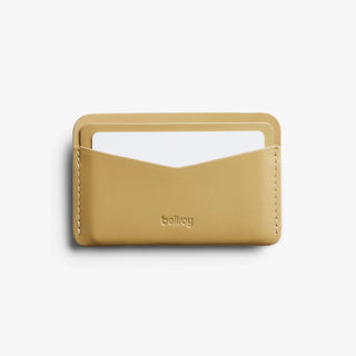 Mustard card slip wallet with centered Bellroy logo and stitched sides.