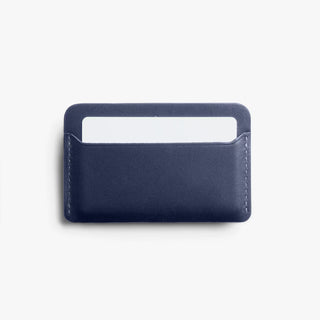 Navy leather card slip with front card pocket visible and top opening