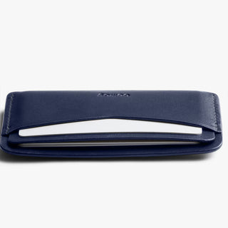 Navy leather card slip with slim profile and stacked card-slot edges