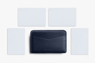 Navy leather card slip holding cards, showing slim interior silhouette