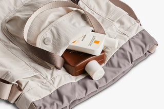 Oat bucket bag interior with card sleeve and bottle holder in the main compartment