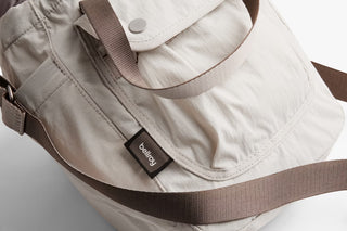 Oat bucket bag with side logo patch and padded webbing handle