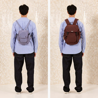 Compact crossbody sling backpack with front buckle and adjustable shoulder straps
