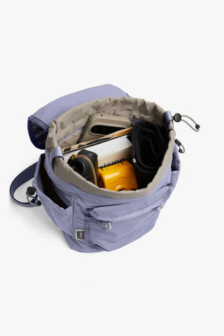 Lilac mini backpack with cinch drawstring top, open compartment and side cords